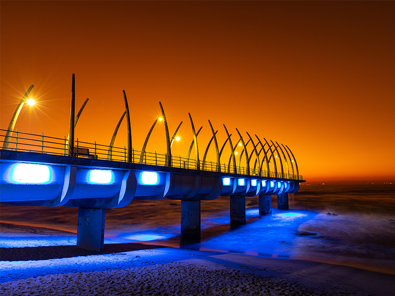 An early morning summer sunrise over the unique whalebone pier