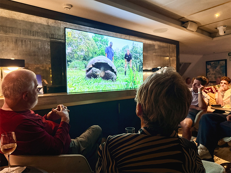 Guests enjoying a presentation in the lounge